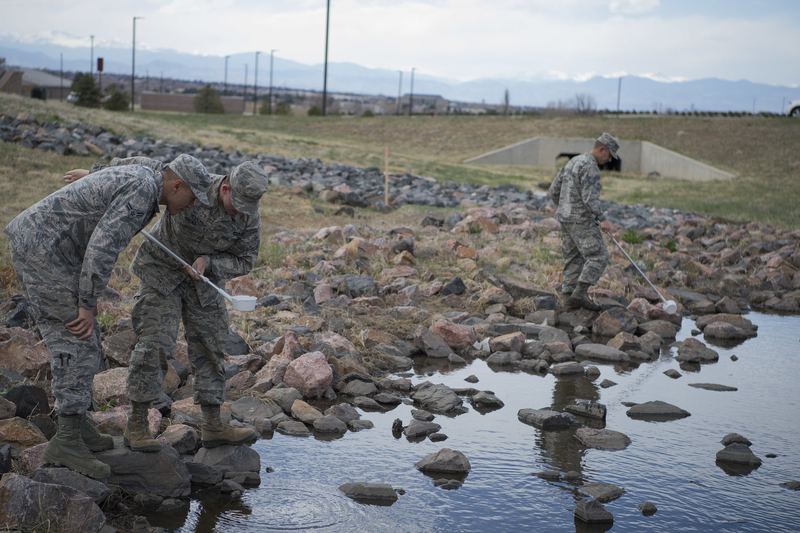Airman 1st Class Aeroll D. Silla, 460th Civil Engineer Squadron pest management apprentice, and Airman 1st Class Bailey